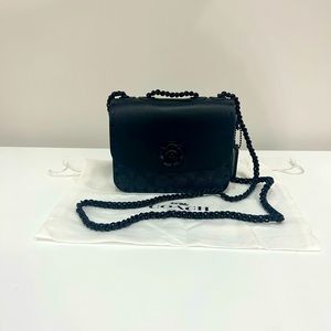 NEVER USED black Coach crossbody. Black Coach logo pattern with black hardware.